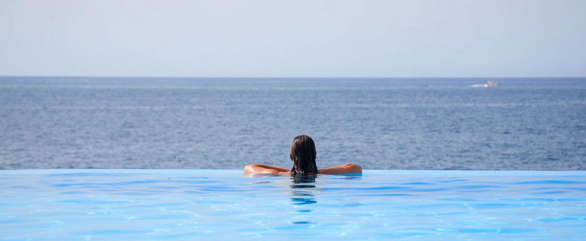 Girl at Vidamar pool looking to the sea